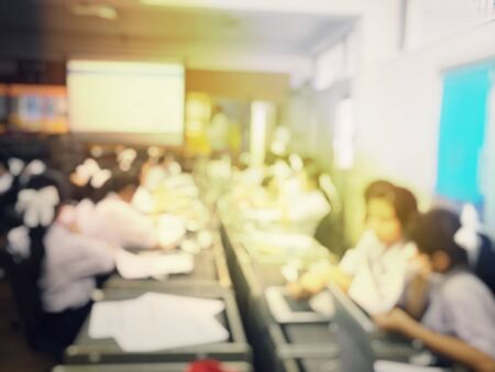 Education concept, Blurred image of the student learning technology and workshop using computer together in computer room in secondary, university for study, Network communication and trainingの写真素材