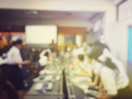 Education concept, Blurred image of the student learning technology and workshop using computer together in computer room in secondary, university for study, Network communication and trainingの写真素材