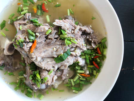 Giant dish of Thai style food. Hot and Spicy Soup with Pork Ribs. Spicy Pork with Pork bone Soup (Lang Zaap). Is a spicy and popular food in Thailand Tourists like it very much.の写真素材