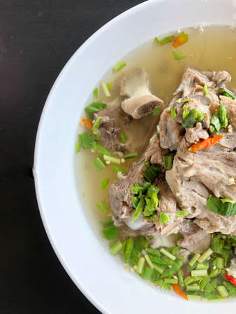 Giant dish of Thai style food. Hot and Spicy Soup with Pork Ribs. Spicy Pork with Pork bone Soup (Lang Zaap). Is a spicy and popular food in Thailand Tourists like it very much.の写真素材