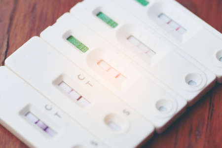 Antigen Test kit with Positive result during swab COVID-19 testing. Coronavirus Self nasal or Home test, Lockdown and Home Isolation concept.の写真素材
