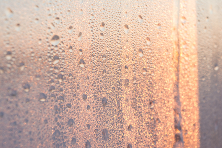 frozen water drops on glass winterの写真素材