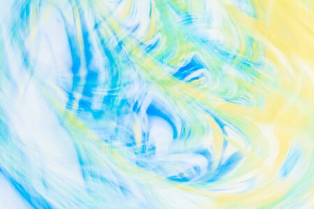 Defocused abstract background with a predominance of yellow and blue flowers, art abstractionの写真素材