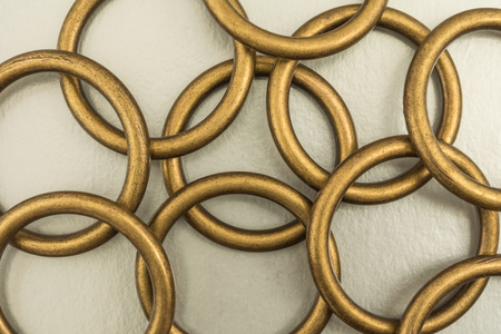 Chaotic arrangement of metal rings on a silvery background