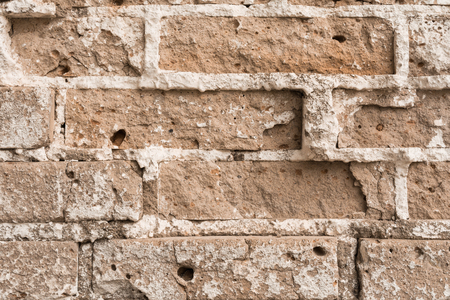 texture of an old ruined brick wall of an ancient building, close up bstract background