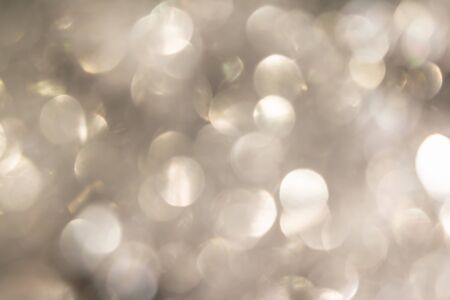 silver blurred sparkling festive abstract background based on Christmas ballsの写真素材