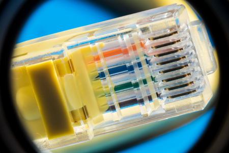 plastic connector for connection to a computer network, macro abstract background