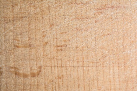 wood texture, surface of a cutting board made of beech has many scratches, abstract backgroundの写真素材