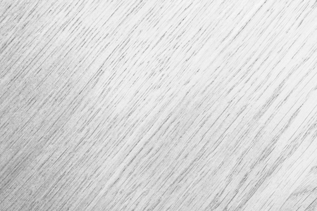 texture of a smooth tree in gray tones with a diagonal arrangement of a drawing, abstract close-up backgroundの写真素材