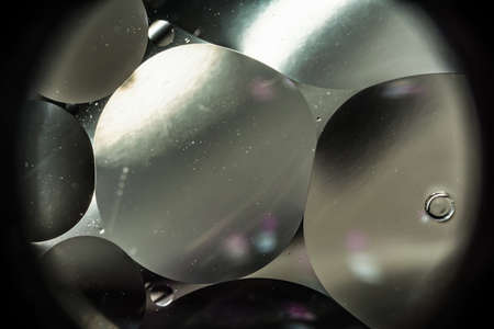 mixing water and oil, beautiful color abstract background based on white and gray circles and ovals,...