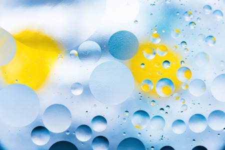 a grainy colored abstract background with scratches and stains consists of circles and balls in a rero style, blurred macro abstractionの写真素材