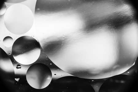 drops water and oil, beautiful gray abstract background based on circles and ovals, macro abstractionの写真素材