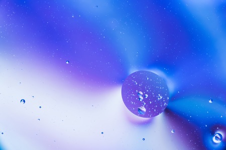 mixing water and oil, beautiful color abstract background based on circles and ovals, macro...