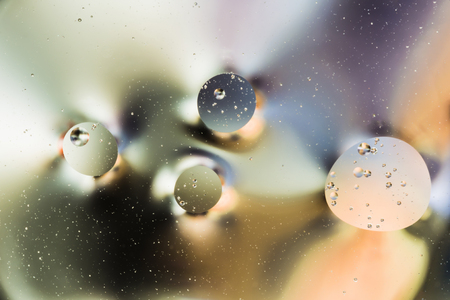 mixing water and oil, beautiful color abstract background based on circles and ovals, macro abstractionの写真素材