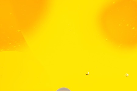 a combination of oil and water, a fantastic abstract macro background with blur elements and motion along the perimeter of the frameの写真素材