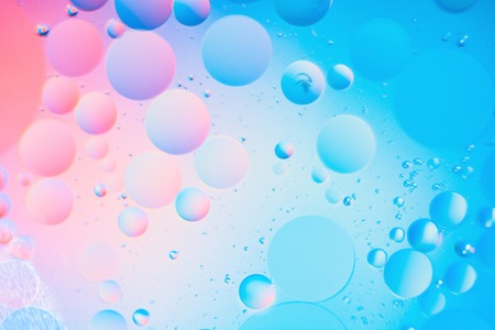 a combination of oil and water, a fantastic abstract macro background with blur elements and motion along the perimeter of the frameの写真素材