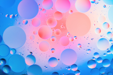 a combination of oil and water, a fantastic abstract macro background with blur elements and motion along the perimeter of the frameの写真素材