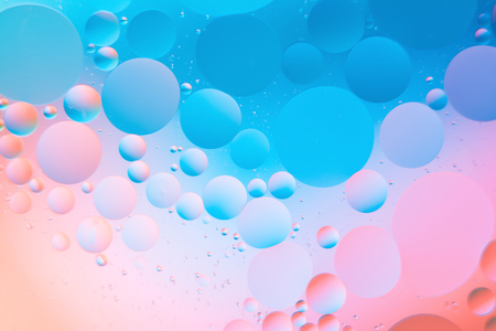 a combination of oil and water, a fantastic abstract macro background with blur elements and motion along the perimeter of the frameの写真素材