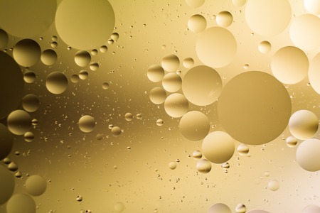 a combination of oil and water, a fantastic abstract macro background with blur elements and motion along the perimeter of the frameの写真素材