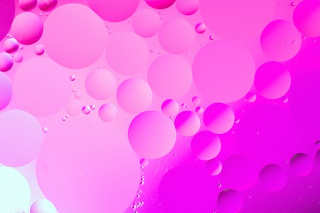 a combination of oil and water, a fantastic abstract macro background with blur elements and motion along the perimeter of the frameの写真素材