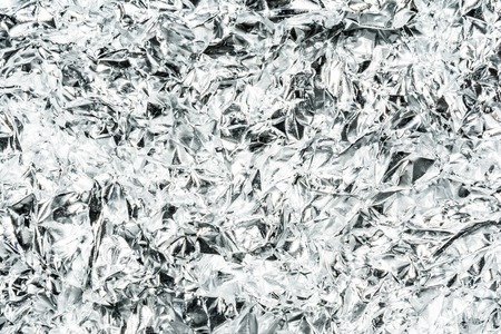 crumpled foil, close-up abstract backgroundの写真素材