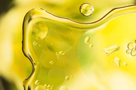 drops of water on the surface of the oil, variation of dissimilar liquids, macro art abstract backgroundの写真素材