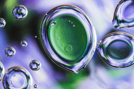 drops of water on the surface of the oil, variation of dissimilar liquids, macro art abstract backgroundの写真素材