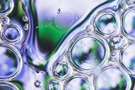 drops of water on the surface of the oil, variation of dissimilar liquids, macro art abstract backgroundの写真素材