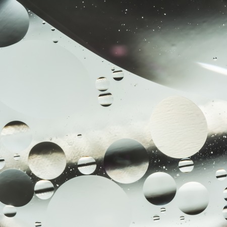 mix oil and water, color background with soft defocusing, macro abstractの写真素材