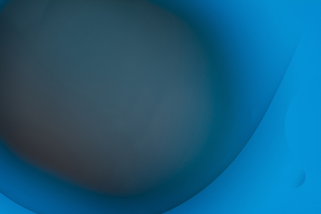 the interaction of water and oil, oil bubbles of various sizes on the water surface, colorful...