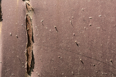 texture of damaged black metal surface, close-up abstract background