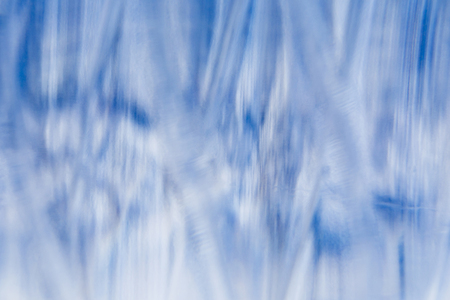 blue blurred abstract background on the basis of glass and waterの写真素材