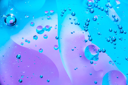 Water and oil bubble blue background. Macro shot of beautiful Water and oil bubble background , with...