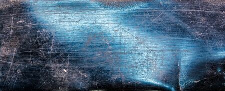 textured black plastic background with scratches and white damage in the form of lines and curves.の写真素材