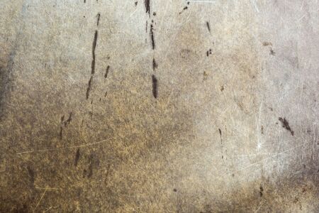 old texture of soiled scratched textolite or plastic, close-up abstract background