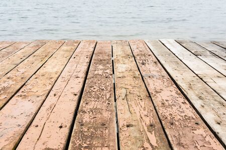 wooden platform beside sea, close-up abstract background