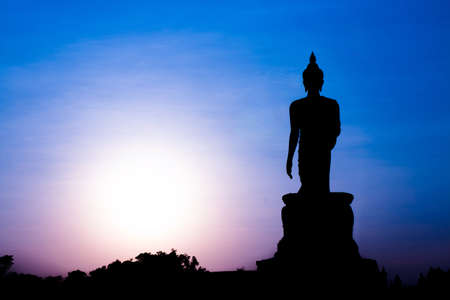 silhouette of Buddha statue sunの写真素材