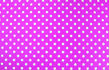 image of red fabric with white polka dotsの写真素材