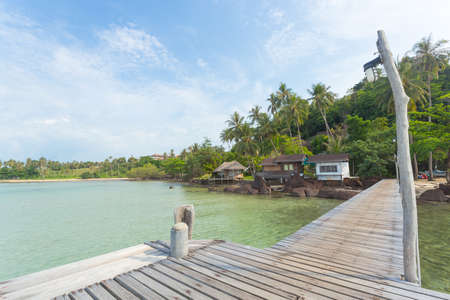 resort is next to the river surrounded by trees at bridge woodの写真素材
