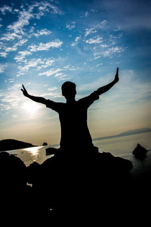 silhouette on beach at sunsetの写真素材