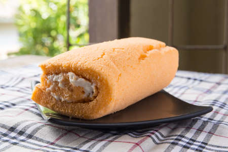 split cream cake on dishの写真素材