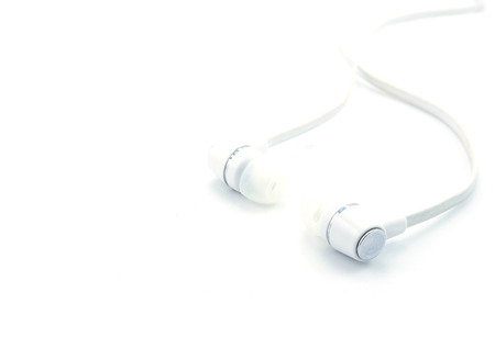 the earphone for listening music on white backgroundの写真素材