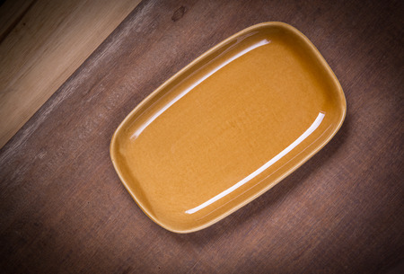 Empty plate on wooden tableの写真素材