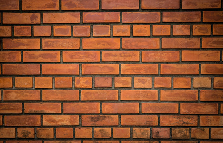 red brick wall used for long timeの写真素材