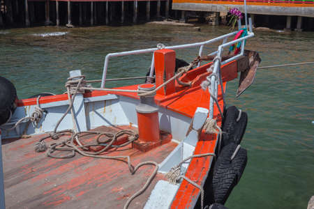prow front view of a ship, anchor winches on the ship, prow on coast