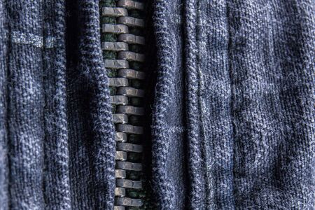 Close up of the blue jeans zipperの写真素材