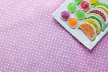 candies. jelly candies in plate on a background. jelly candies in bowl on a background.の写真素材