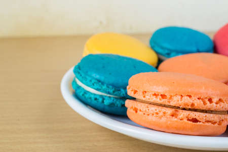 French macaroons on plate, with vintage pastel filteredの写真素材