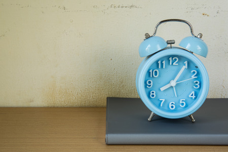 Alarm clock on text booksの写真素材