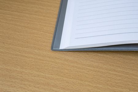 notebook at wood background
